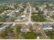 Expansive aerial view of a suburban neighborhood with tree-lined streets and well-maintained homes at 11304 Sedgefield Ave, Spring Hill, FL 34608