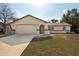 Charming single-Gathering home featuring a two-car garage and a well-manicured front yard at 11304 Sedgefield Ave, Spring Hill, FL 34608