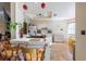 Bright eat-in kitchen with white cabinets, large sink and bar stool seating at the breakfast bar at 11304 Sedgefield Ave, Spring Hill, FL 34608