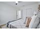 A well-lit bedroom with a closet and a door, featuring neutral walls and wood-like flooring at 11437 59Th Ter, Seminole, FL 33772