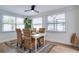 Bright dining area with natural light, wood floors, and stylish decor at 11437 59Th Ter, Seminole, FL 33772