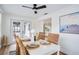 Dining room featuring wood floors and access to the outdoor pool area at 11437 59Th Ter, Seminole, FL 33772