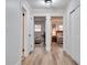 Hallway with wood flooring leading to the bedrooms at 11437 59Th Ter, Seminole, FL 33772