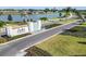 Landscaped entrance to Isles at Bayview featuring water feature, manicured landscaping and a view of the lake at 11751 Moonsail Dr, Parrish, FL 34219