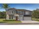 Charming two-story home featuring a 2-car garage, well-manicured lawn, and a classic architectural design at 11857 Blue Diamond Trl, Parrish, FL 34219