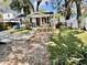 Charming one-story home with covered porch, and white picket fence at 1210 E Sligh Ave, Tampa, FL 33604