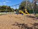 Community playground set with swings, slide and climbing apparatus at 1210 E Sligh Ave, Tampa, FL 33604