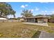 Backyard featuring a brick patio, outdoor kitchen, and screened porch at 1314 Oak Valley Dr, Seffner, FL 33584