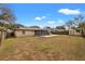 Backyard with patio, outdoor kitchen, shed, and screened-in porch at 1314 Oak Valley Dr, Seffner, FL 33584