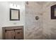 Elegant bathroom boasts a tiled shower, a stylish mirror, and a contemporary vanity at 1545 Pasadena Dr, Dunedin, FL 34698