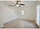 Bright bedroom featuring hardwood floors and a window allowing natural light at 1545 Pasadena Dr, Dunedin, FL 34698