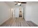 Bright bedroom featuring hardwood floors and an ensuite bathroom with modern fixtures at 1545 Pasadena Dr, Dunedin, FL 34698