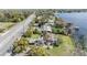 Scenic aerial perspective of lakefront residence, highlighting its prime location at 2050 W Bearss Ave, Tampa, FL 33618