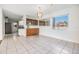 Dining room featuring white tiled flooring and a decorative chandelier at 2050 W Bearss Ave, Tampa, FL 33618