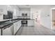 Bright kitchen featuring stainless steel appliances and dark countertops at 2050 W Bearss Ave, Tampa, FL 33618