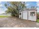 Exterior view of shed near the lake with mature tree coverage at 2050 W Bearss Ave, Tampa, FL 33618