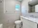 Modern bathroom with tiled walls, stylish vanity, and sleek fixtures at 2111 26Th S St, St Petersburg, FL 33712