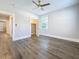 Bedroom with new dark wood floors, a ceiling fan, and a closet at 2111 26Th S St, St Petersburg, FL 33712