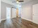 Well-lit bedroom with ensuite bathroom and closet access, featuring neutral walls and a contemporary ceiling fan at 2111 26Th S St, St Petersburg, FL 33712