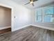 This bedroom offers windows for natural light, sleek flooring, and an open doorway at 2111 26Th S St, St Petersburg, FL 33712