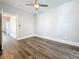 This bedroom features sleek ceiling fan, neutral walls, stylish flooring, and bright white trim at 2111 26Th S St, St Petersburg, FL 33712