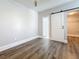 Cozy bedroom with a sliding barn door to the closet and an ensuite bathroom, blending style and functionality at 2111 26Th S St, St Petersburg, FL 33712