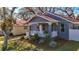 Attractive house with a covered front porch, white columns, and neat landscaping at 2111 26Th S St, St Petersburg, FL 33712