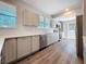 Modern kitchen features stainless steel appliances, white subway tile backsplash, and light-colored cabinets at 2111 26Th S St, St Petersburg, FL 33712