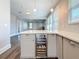 Open-concept kitchen with a wine cooler and modern pendant lighting at 2111 26Th S St, St Petersburg, FL 33712