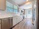 Renovated kitchen has stainless appliances, white subway tile and natural light at 2111 26Th S St, St Petersburg, FL 33712