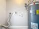 Utility room featuring new water heater and plumbing fixtures at 2111 26Th S St, St Petersburg, FL 33712