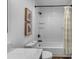 Modern bathroom featuring white subway tile, a shower-tub, and a stylish vanity with a marble countertop at 227 84Th Ne Ave, St Petersburg, FL 33702