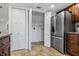 Walk-in pantry boasts ample storage space with custom shelving and tile flooring at 227 84Th Ne Ave, St Petersburg, FL 33702