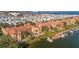 Expansive aerial view of the community, featuring a waterfront, boat docks, and well-maintained landscaping at 2717 Via Cipriani # 614B, Clearwater, FL 33764