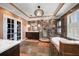 Elegant bathroom featuring a soaking tub, a walk-in shower, and dual vanities at 2717 Via Cipriani # 614B, Clearwater, FL 33764