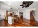 Open dining area featuring bar-style seating, connecting the kitchen, living area and staircase at 2717 Via Cipriani # 614B, Clearwater, FL 33764