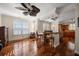 Well-lit dining area features shuttered windows, modern lighting, and hardwood floors throughout at 2717 Via Cipriani # 614B, Clearwater, FL 33764