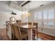 Well-lit dining area featuring plantation shutters, modern lighting, and bar-style seating at 2717 Via Cipriani # 614B, Clearwater, FL 33764