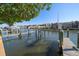 Picturesque view of the community docks and waterfront homes under a clear blue sky at 2717 Via Cipriani # 614B, Clearwater, FL 33764