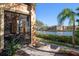 Outdoor patio featuring a view of the waterfront, lush landscaping, and the community at 2717 Via Cipriani # 614B, Clearwater, FL 33764