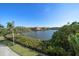 Scenic view of the community waterfront and landscaping under a clear blue sky at 2717 Via Cipriani # 614B, Clearwater, FL 33764