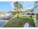 Waterfront home with a lush backyard, boat dock and lift, offering direct access to the open water at 320 Georgia Ave, Crystal Beach, FL 34681