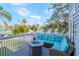 Relaxing outdoor deck with comfortable seating and fire pit, perfect for enjoying the serene views at 320 Georgia Ave, Crystal Beach, FL 34681