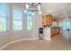 Bright dining area with tile floors, lots of natural light, and a convenient view into the kitchen at 320 Georgia Ave, Crystal Beach, FL 34681