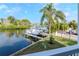 Stunning waterfront view showcasing the canal, boat docks, and lush landscaping from an elevated vantage point at 320 Georgia Ave, Crystal Beach, FL 34681