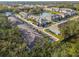 Aerial view of the community showcasing well-maintained landscaping, a pond, and nearby amenities at 3313 Pleasant Willow Ct, Brandon, FL 33511