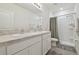 Well-lit bathroom with double sinks, a large mirror, and a shower-tub combination at 3313 Pleasant Willow Ct, Brandon, FL 33511