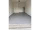 Spacious garage featuring durable epoxy flooring and ample room for storage and parking at 3313 Pleasant Willow Ct, Brandon, FL 33511