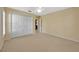 Bright bedroom featuring carpet flooring, a double closet, and neutral paint at 37157 Foxrun Pl, Zephyrhills, FL 33542