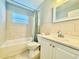 Bathroom with tile, tub, shower combo, and vanity at 3902 W Iowa Ave, Tampa, FL 33616